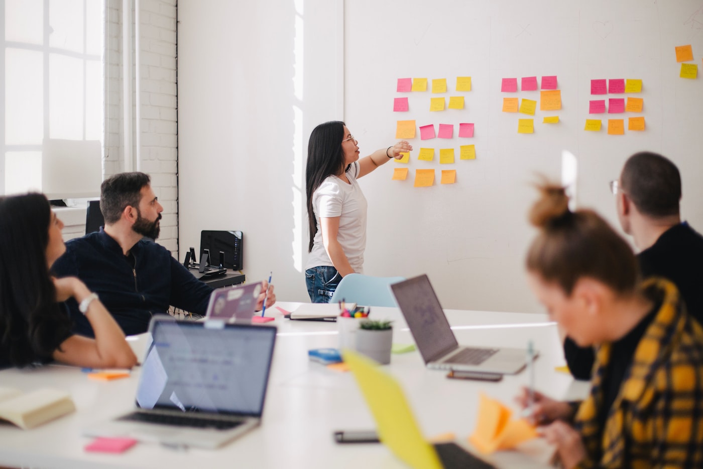 Affiliate managers in a strategy meeting reviewing network growth plans